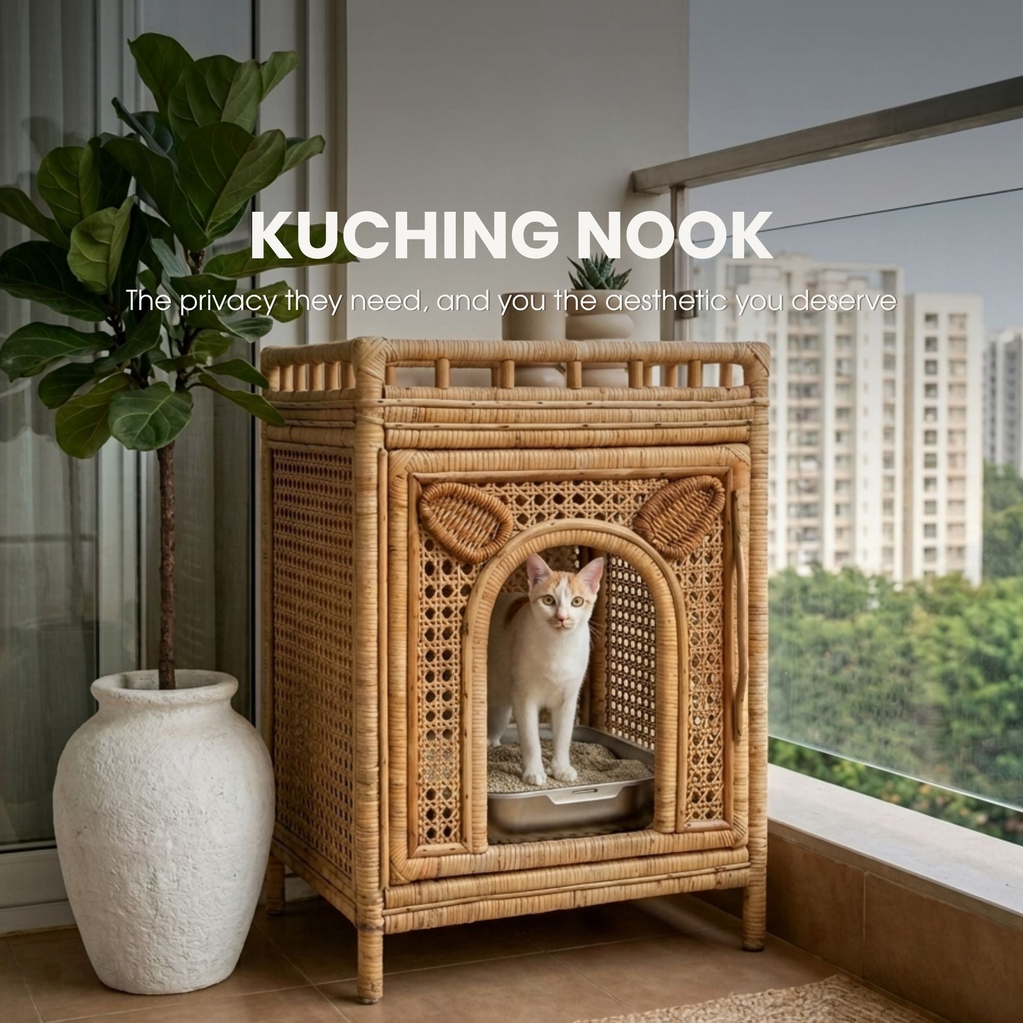 A white cat sits inside a tall woven rattan cat house with an arched entrance, placed on a balcony beside a large potted plant and window. White text at the top reads 'KUCHING NOOK' with smaller descriptive text below.